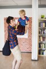Playful father lifting son — Stock Photo