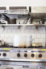 Metal container on stove — Stock Photo