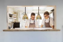 Young chefs working together — Stock Photo
