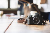 Camera on table in cafe — Stock Photo