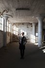 Lonely businessman in abandoned building — Stock Photo