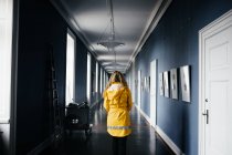 Woman walking in corridor — Stock Photo