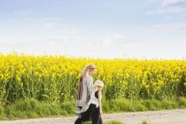 Mother and daughter walking — Stock Photo