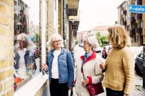 Senior women doing window shopping — Stock Photo