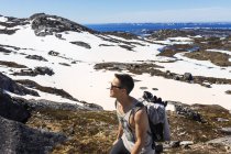 Hiker walking on rocky mountain — Stock Photo