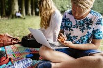 Students studying in park — Stock Photo