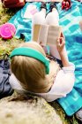 Female student reading book — Stock Photo