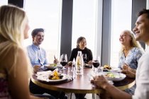Friends having meal at restaurant — Stock Photo