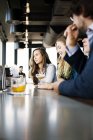 Business people at bar — Stock Photo