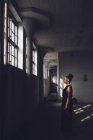 Woman in abandoned factory — Stock Photo