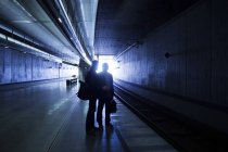 Silhouette businessmen at subway station — Stock Photo