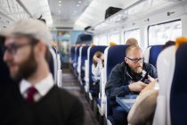 Business people travelling in train — Stock Photo