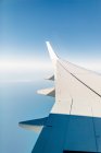 Cropped image of airplane wing — Stock Photo