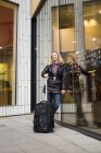 Happywoman with luggage — Stock Photo