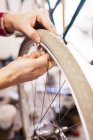 Man repairing bicycle tire — Stock Photo