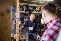 Father and son at bicycle shop — Stock Photo