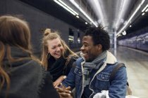 Friends having fun at subway station — Stock Photo