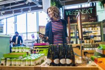 Young woman in supermarket — Stock Photo