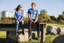 Couple sitting on table at park — Stock Photo