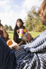 Man and female friends during picnic — Stock Photo