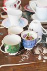 Various tea cups and saucers — Stock Photo