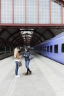 Female friends at railroad station — Stock Photo