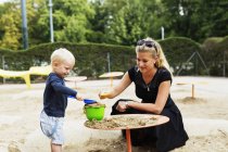 Mother and son in playground — Stock Photo
