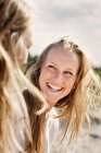 Cheerful woman looking at friend — Stock Photo