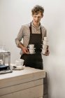 Young male barista — Stock Photo