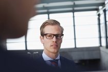 Businessman looking at coworker during meeting — Stock Photo