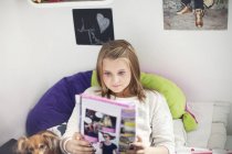 Girl reading novel — Stock Photo