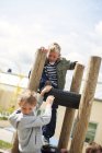 Schoolboys playing at schoolyard — Stock Photo