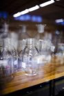 Empty beakers in cabinet — Stock Photo