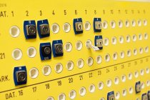 Keyholes on yellow wall — Stock Photo