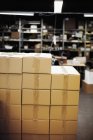 Cardboard boxes in warehouse — Stock Photo