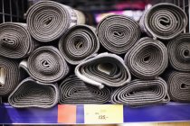 Rolled up carpets for sale — Stock Photo