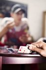 Hand opening playing cards — Stock Photo