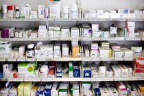 Various medicines on shelves — Stock Photo