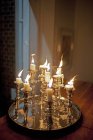 Burning candles with candlestick holders — Stock Photo