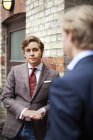 Businessman standing with partner — Stock Photo