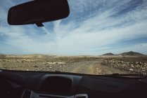Desert road seen from car — Stock Photo