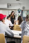 Teacher and students in classroom — Stock Photo