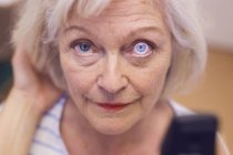 Senior woman having eyes checked — Stock Photo