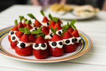 Strawberries on plate, selective focus — Stock Photo