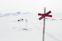 Sign on pole in winter — Stock Photo