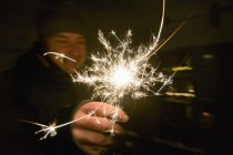 Man holding sparkle — Stock Photo