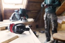 Man plugging in power tool — Stock Photo