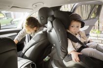 Toddler boy sitting in car — Stock Photo