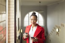 Portrait of woman in red coat — Stock Photo