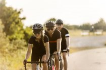 Cyclists riding on rural road — Stock Photo